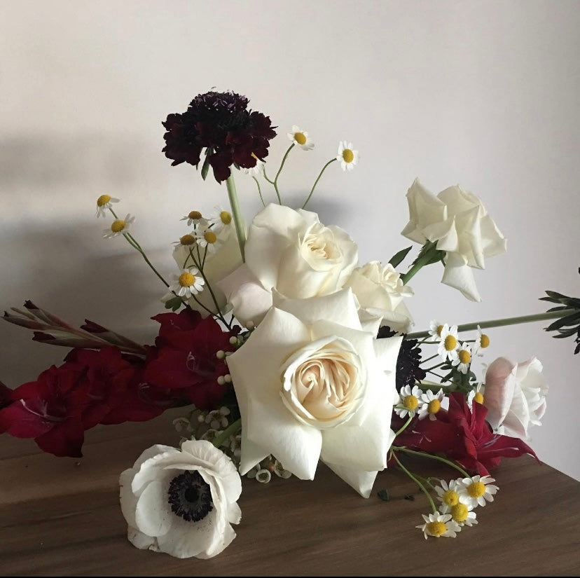 Luxurious floral arrangement featuring white roses, red blooms, and delicate daisies from Naked Fern Florals, showcasing a romantic pink, red & white design perfect for special occasions.