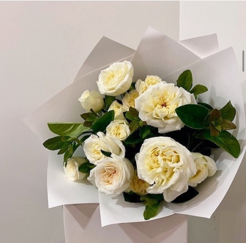 A beautiful bouquet of creamy white roses, crafted as part of the Tiffany Flowers: Pastel Pure Perfumes Bouquet by Naked Fern Florals, the perfect birthday flower gifts for any occasion. 
 #brisbaneflorist #everydayflowers #mothersdayflowers #Nakedfernflowers #weddingflowers